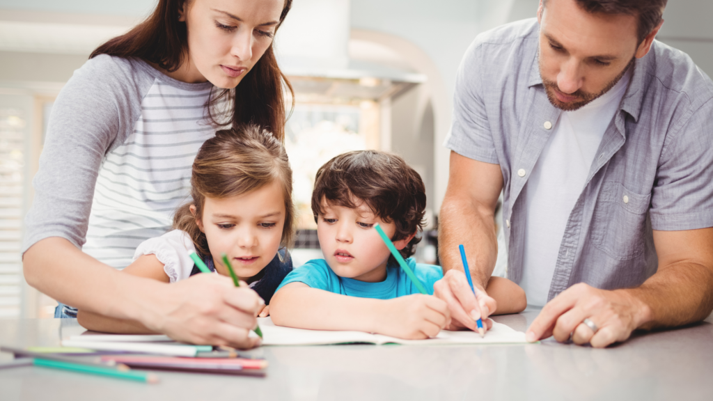 family around the table writing