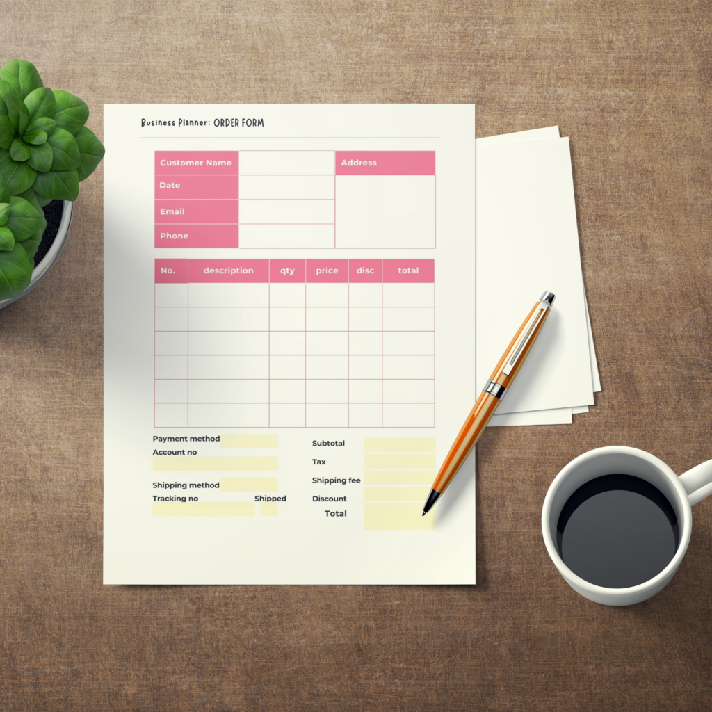 Business planner worksheet on a wodden table with a cup of tea, a pen and a plant