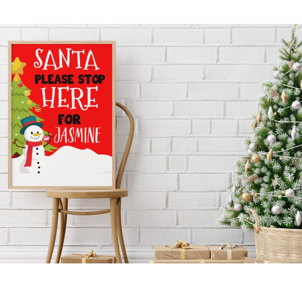 A christmas poster next to a christmas tree