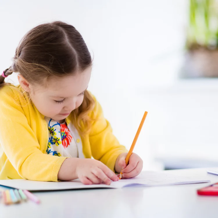 A GIRL DRAWING A PICTURE