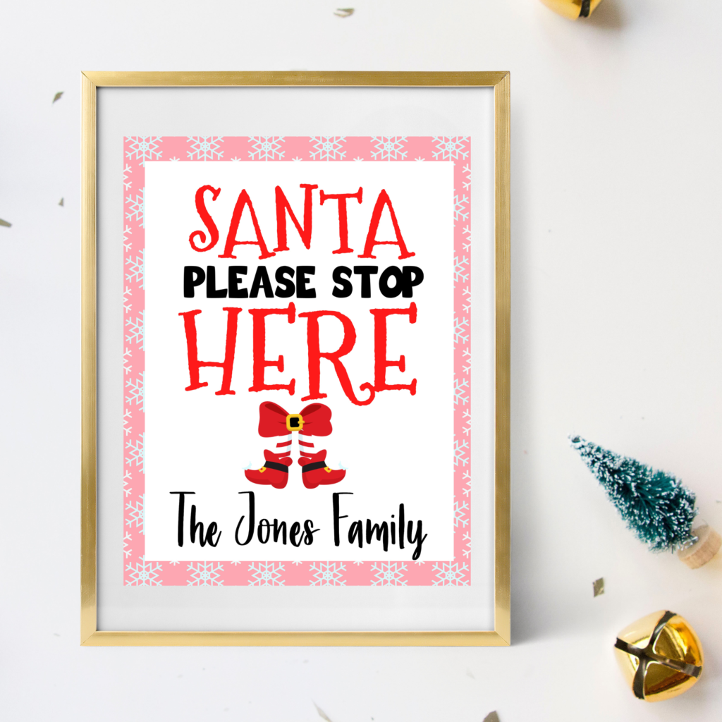 pink santa stop here sign in a frame