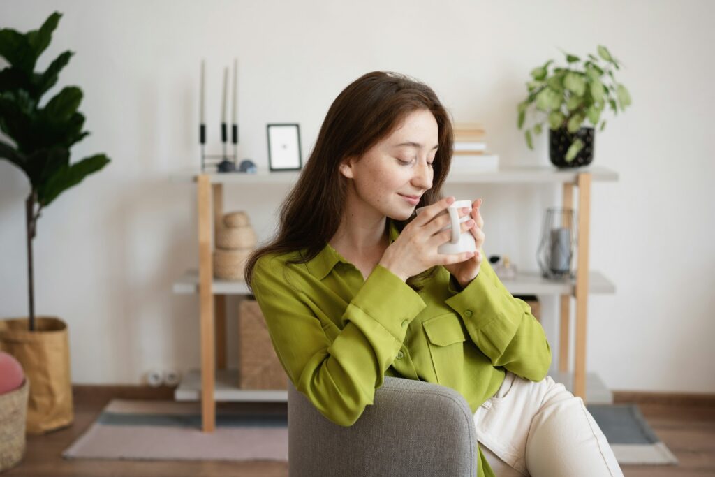 a lady with a Morning coffee from the blog post How to Organize Your Day With a New Baby